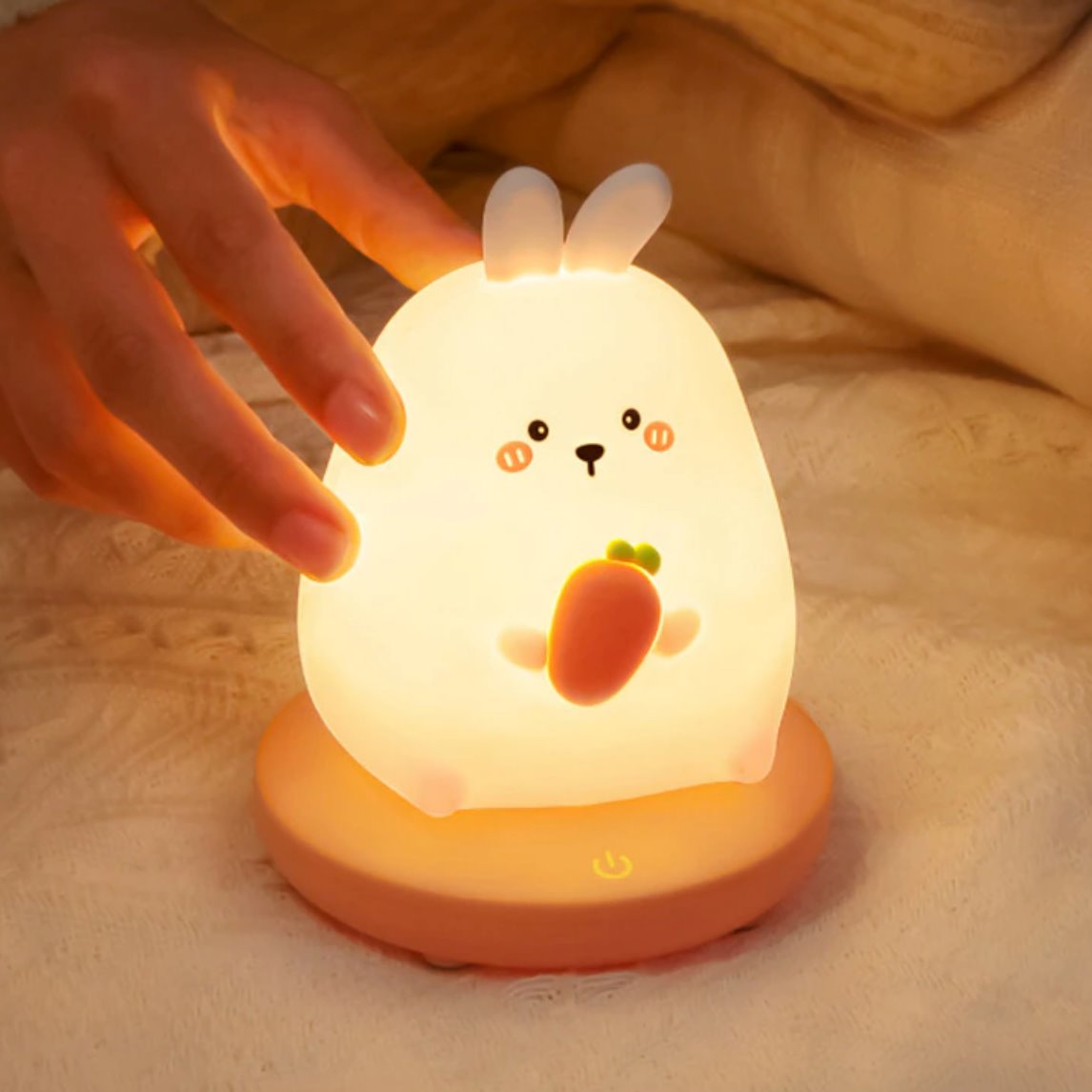 Kawaii bunny silicone LED night light, warm white glow, 3 brightness settings, USB rechargeable, 10-hour battery life.