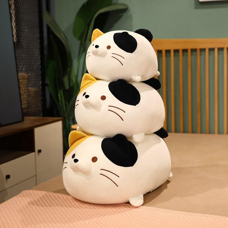 Stack of three chubby kawaii cat plushies; white with black spots and yellow accents; soft PP cotton filling.
