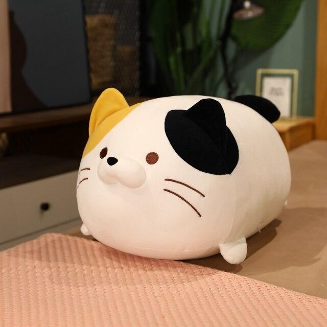 Kawaii chubby cat plush toy, white with black and yellow patches, soft PP cotton filling, hypoallergenic.