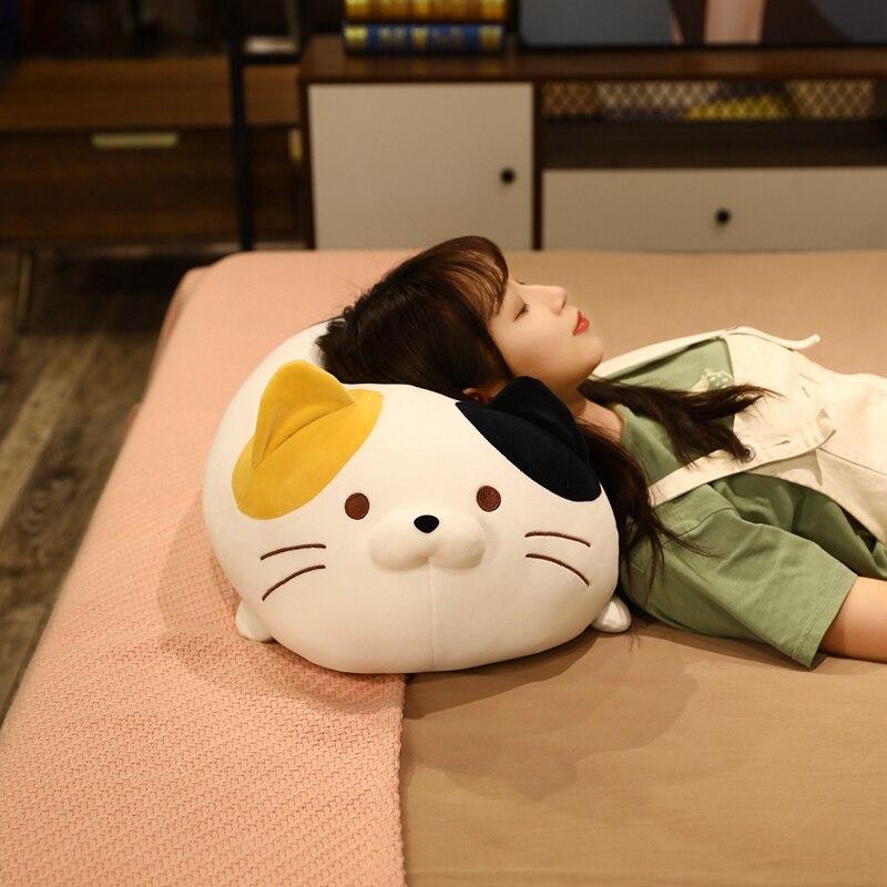 Kawaii chubby cat plush toy; soft, white with yellow & black patches.  Perfect for cuddling!