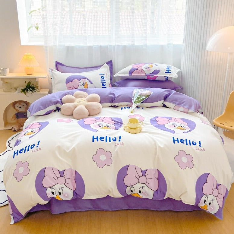 Purple and white kawaii duck bedding set, featuring a brown bear design on the reverse. Includes duvet cover, flat sheet, and pillowcases.  Polyester microfiber.