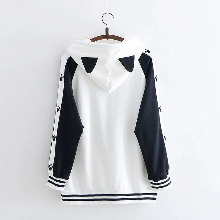 Kawaii kitty paw print hoodie; white polyester, black sleeves, long-sleeved, onesize.