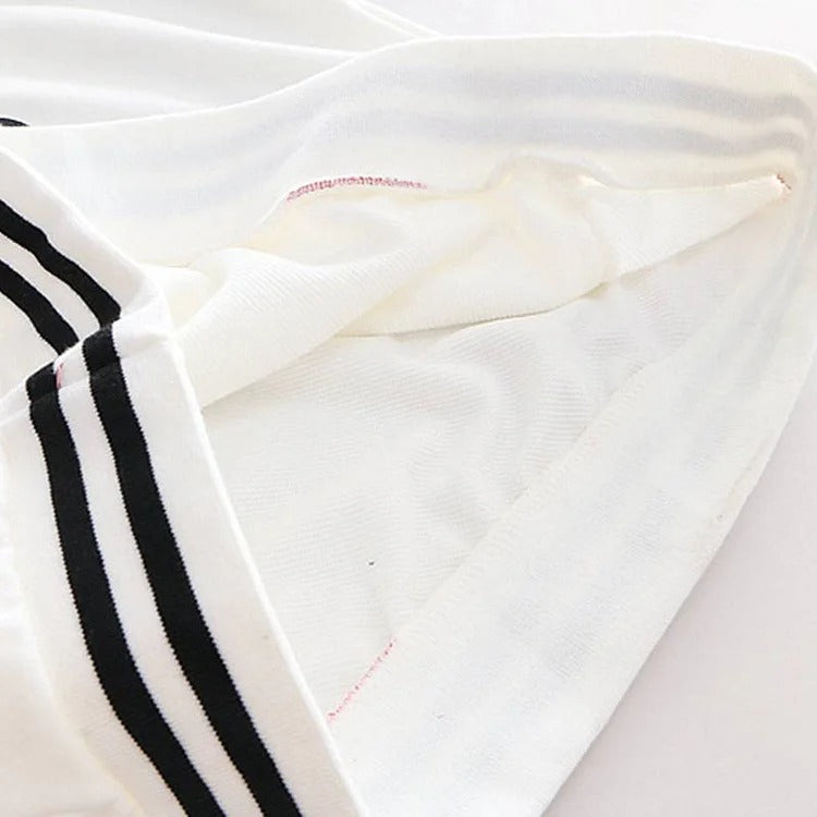 Cozy white & black polyester kawaii kitty paw print hoodie; onesize fits most. Features long sleeves & a hooded neckline.