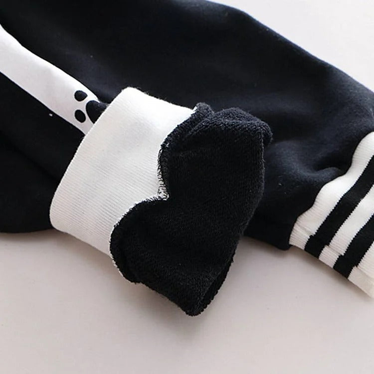 Kawaii black & white polyester hoodie; features kitty paw prints, long sleeves, and a hooded neckline. One size fits most.