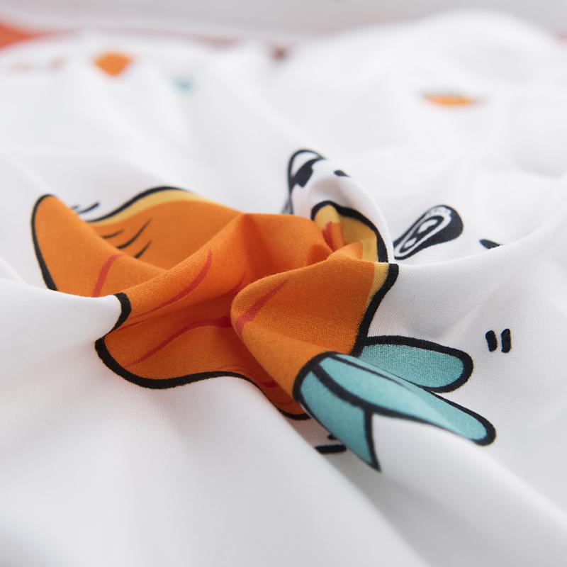 Orange and white reversible kids bedding set featuring bunnies and carrots. Soft, 100% polyester microfiber.