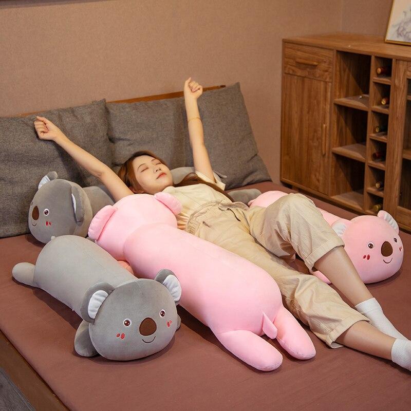 Soft pink & grey koala plush pillow buddy, ergonomic design, premium PP cotton filling. Improves sleep posture.