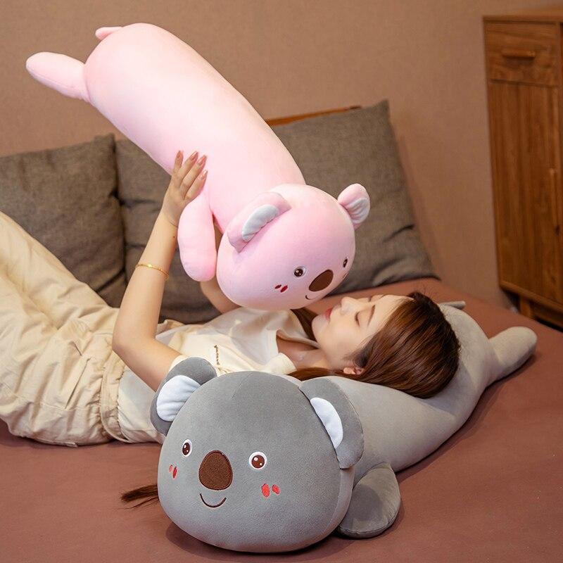 Soft pink & grey koala plush pillow buddies, perfect for cuddling & sleep. Premium PP cotton filling, ergonomic design. Allergy-free.