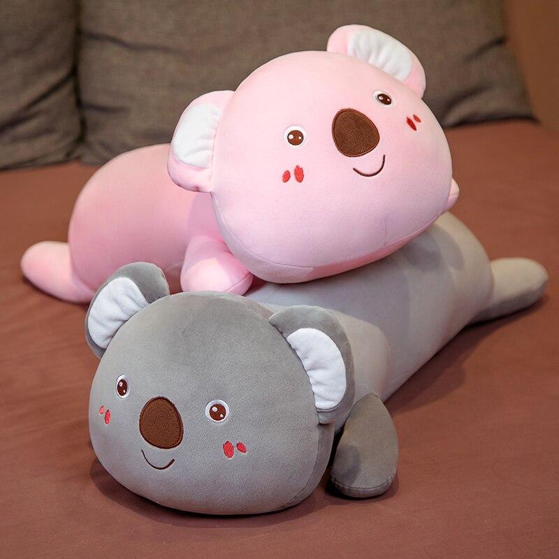 Adorable pink & grey koala plush pillow buddies, made with soft PP cotton, perfect for sleep & relaxation.