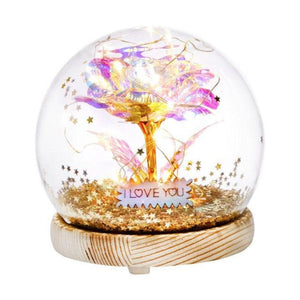 LED Galaxy Rose dome gift with preserved red rose, warm lights, wooden base, and sparkling glitter. Perfect romantic gift.