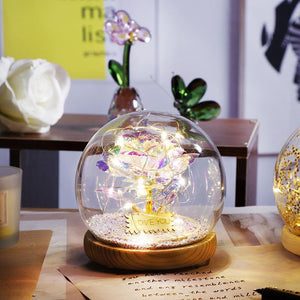 Red rose preserved in glass dome with LED lights; galaxy effect, wooden base. Perfect gift.