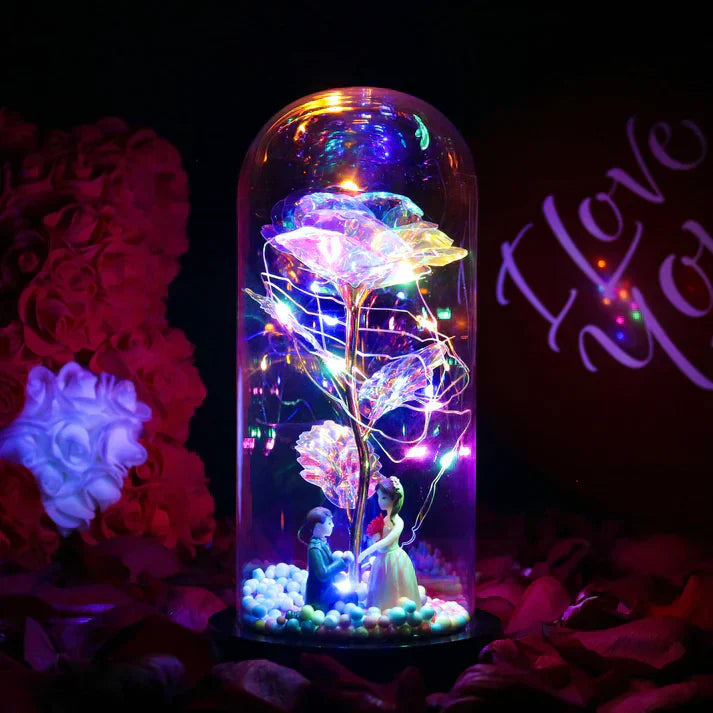 Iridescent LED rose in glass dome with 20 warm white lights, wooden base, & couple figurine. Perfect gift!