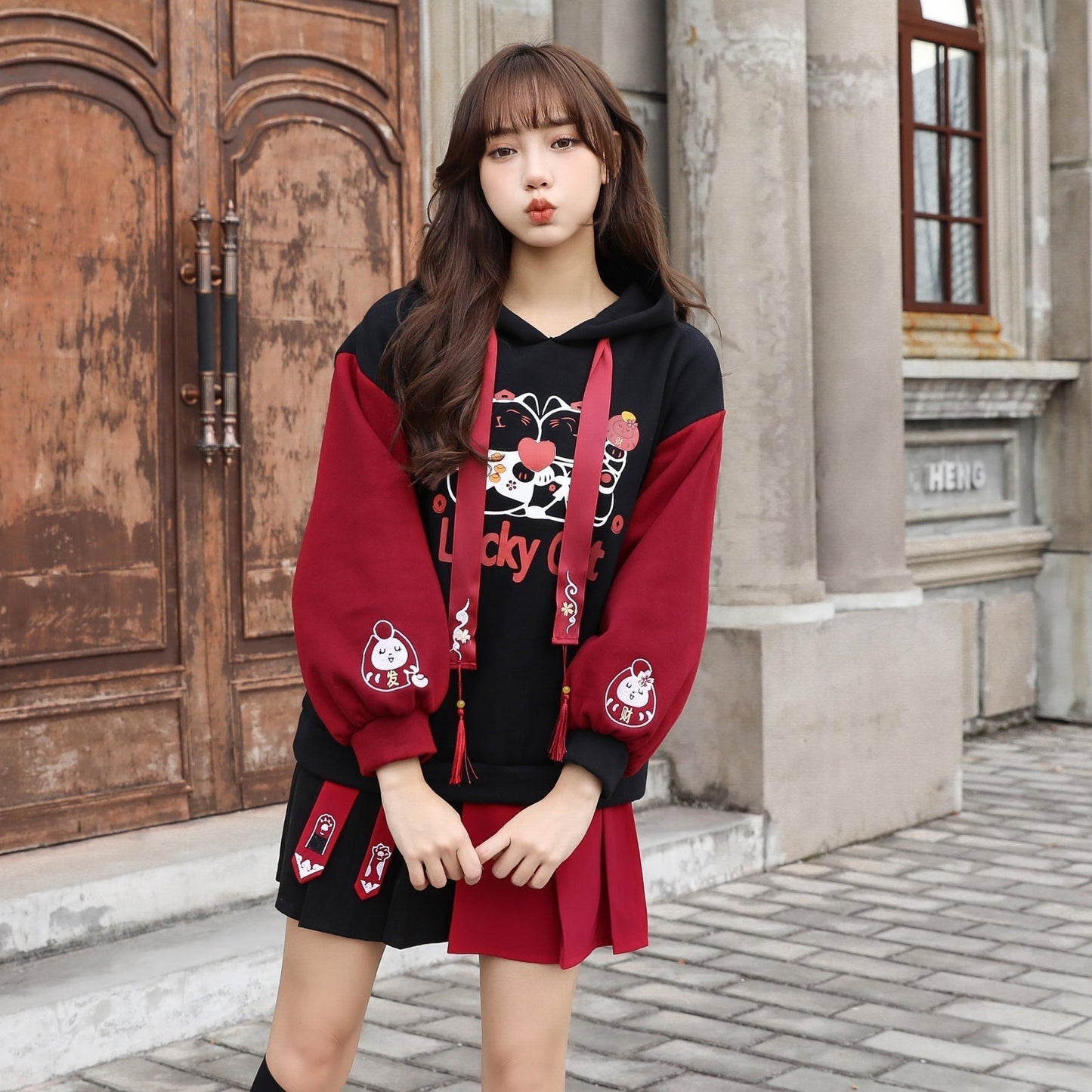 Red & black lucky cat hoodie and skirt set; cotton, cartoon print, tassels.