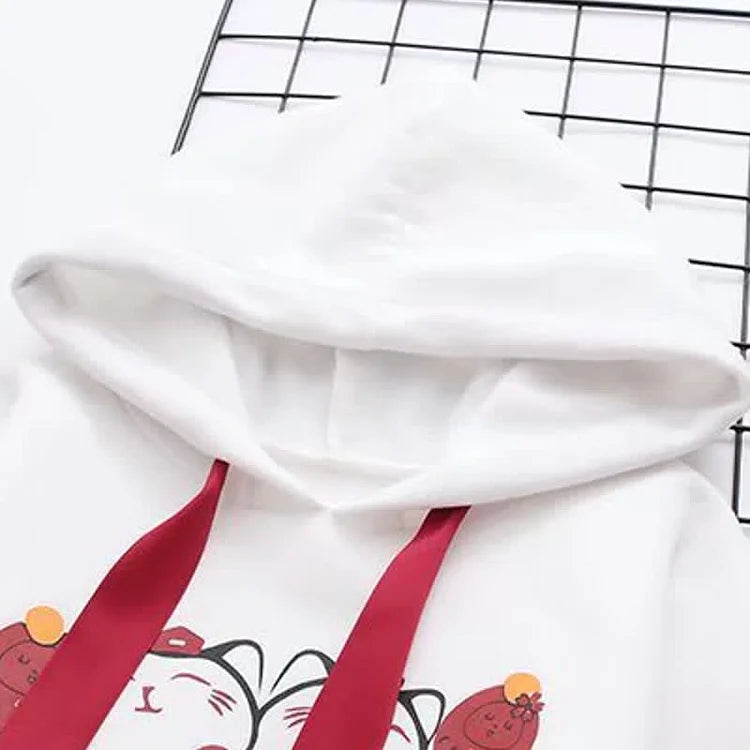 White cotton lucky cat hoodie & skirt set; red tassels, letter print, cat paws design.  Cute, casual outfit.