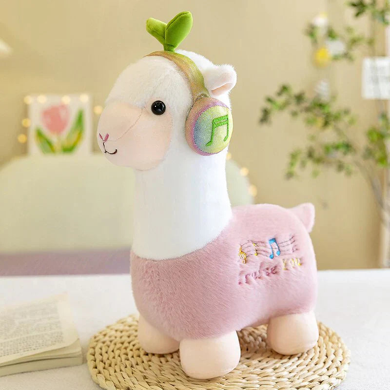 Adorable pink musical alpaca plush toy with soft cotton, wearing headphones, ethically sourced.