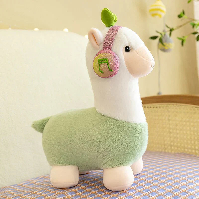 Adorable green musical alpaca plush toy with pink headphones, soft cotton, and ethically sourced materials. Perfect for cuddling!