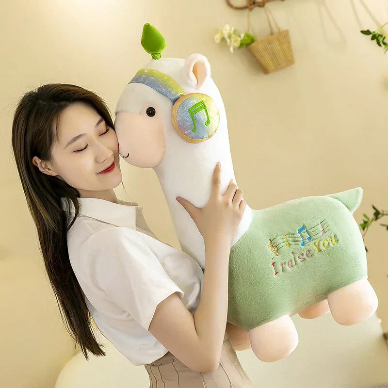 Adorable musical alpaca plush toy; soft cotton, pastel green & white, plays music, ethically sourced.