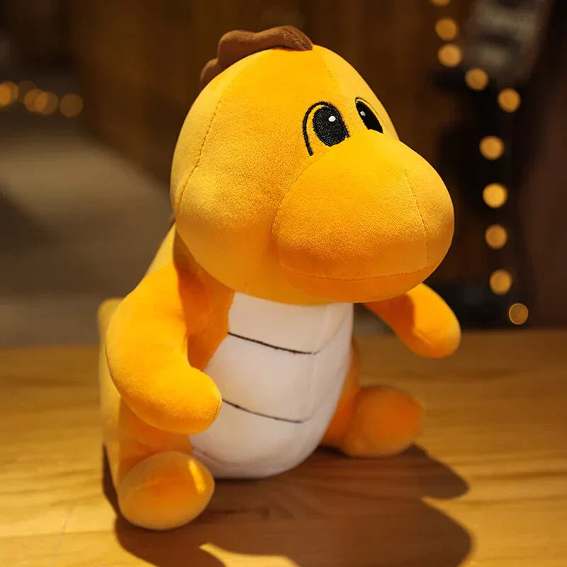 Adorable orange chibi dinosaur plush toy, made of soft PP cotton.  Available in small, medium, & large sizes.