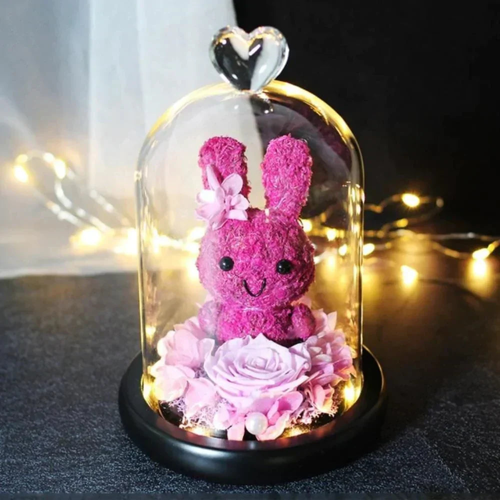 Pink bunny & preserved rose LED display in glass dome; 12x20cm, battery-operated, perfect gift.