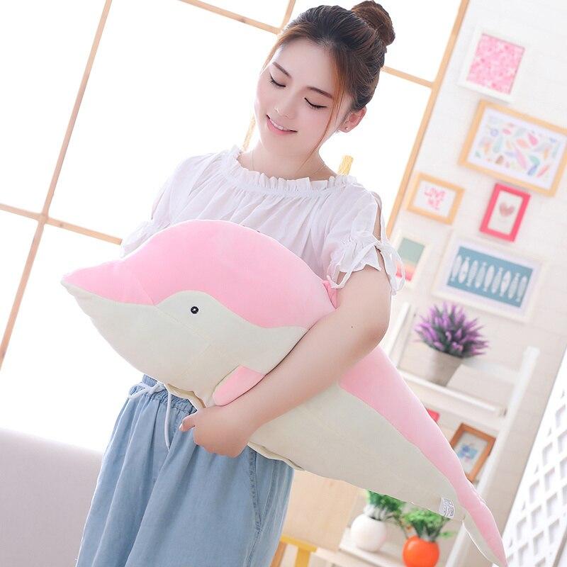 Pink kawaii dolphin plush body pillow, soft PP cotton filling, promotes relaxation and better sleep. Allergy-friendly.
