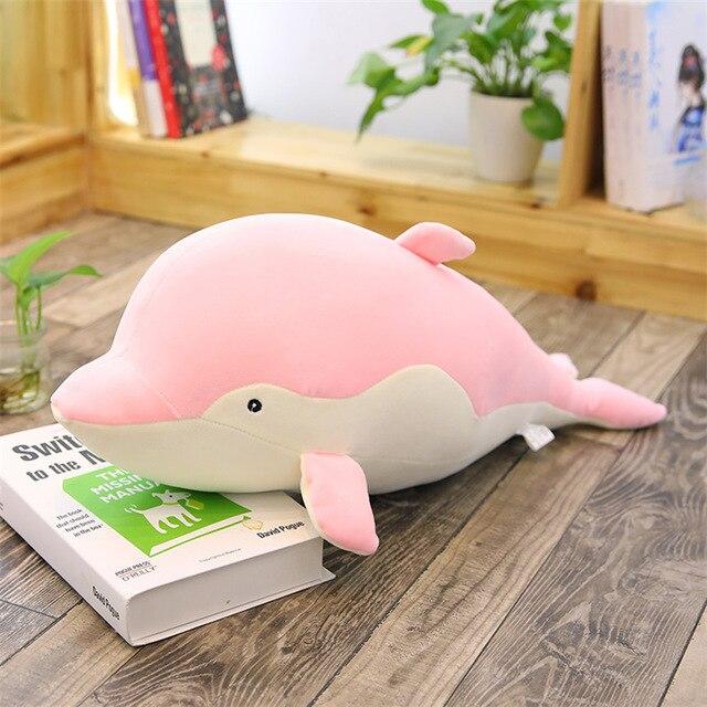 Pink kawaii plush dolphin body pillow; soft PP cotton filling; promotes relaxation and better sleep.