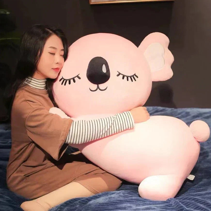 Pink koala plush toy, hypoallergenic PP cotton, soft & cuddly, perfect for relaxing.