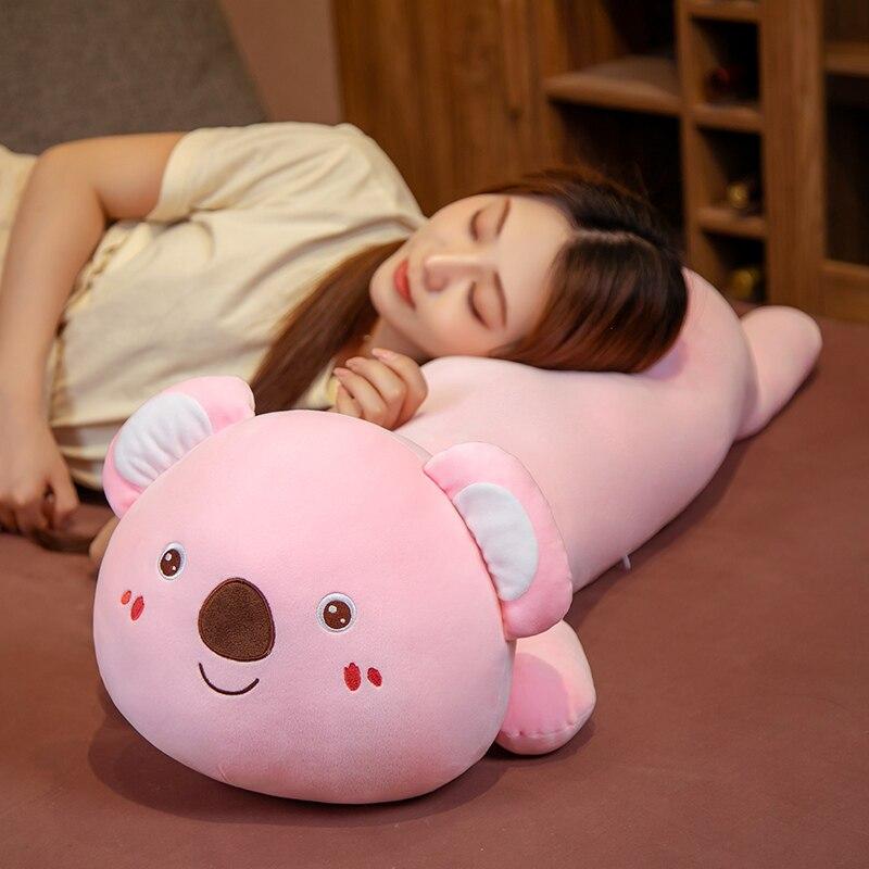 Pink koala plush pillow buddy, soft PP cotton, ergonomic design, improves sleep posture.