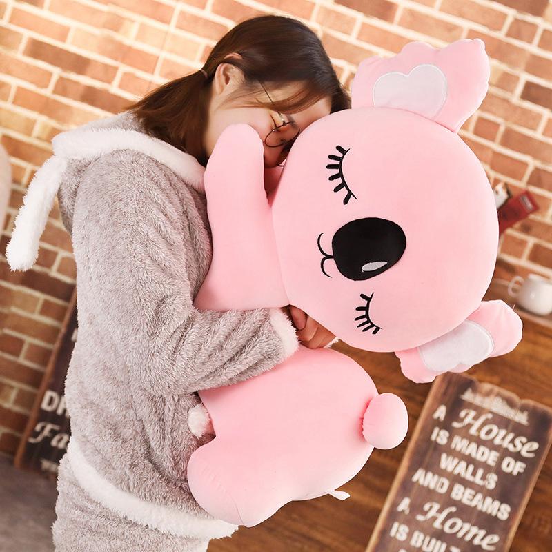 Pink koala plush toy, soft PP cotton, hypoallergenic, cuddly, perfect for hugging and sleeping.