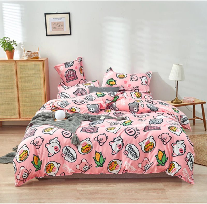 Pink pig cartoon bedding set, reversible microfiber, includes duvet cover, flat sheet, and pillowcases.  Soft, cozy, and machine washable.