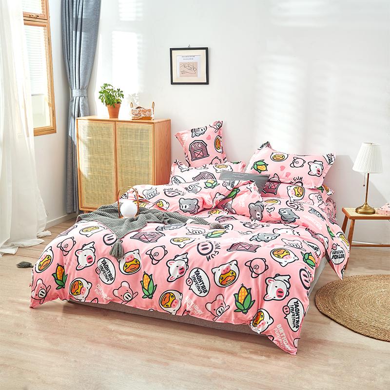 Pink pig-themed bedding set; soft polyester microfiber; reversible duvet cover, flat sheet, pillowcases; cute pig illustrations; machine washable.