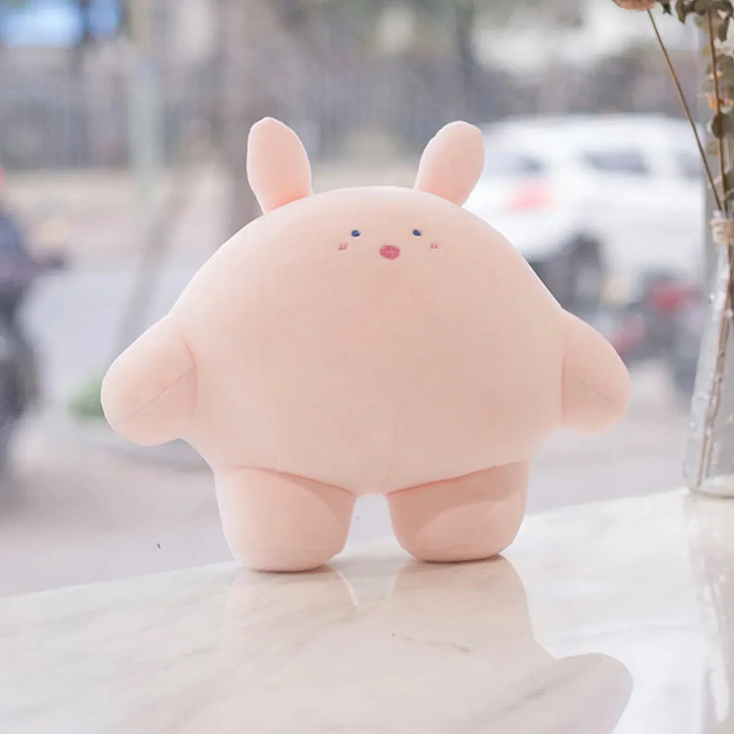 Adorable pink plush bunny pillow; soft, cuddly, perfect for cuddling or as a decorative accent.  PP cotton filled.