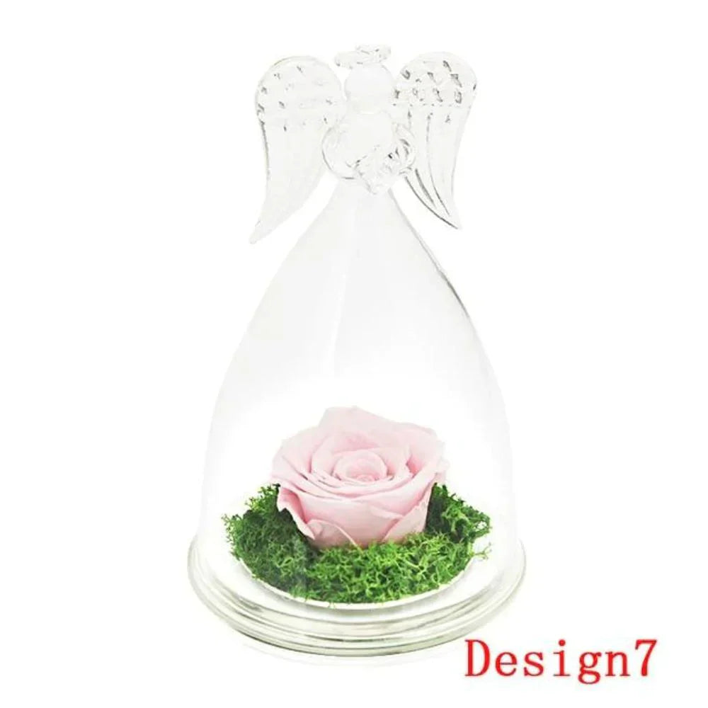 Pink preserved rose in glass dome with angel wings, on wooden base.  Lasts 3-5 years.  Perfect gift.