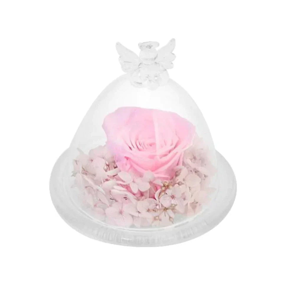 Preserved pink rose in glass dome with angel wings, on wooden base.  Lasts 3-5 years. 12 colors available.