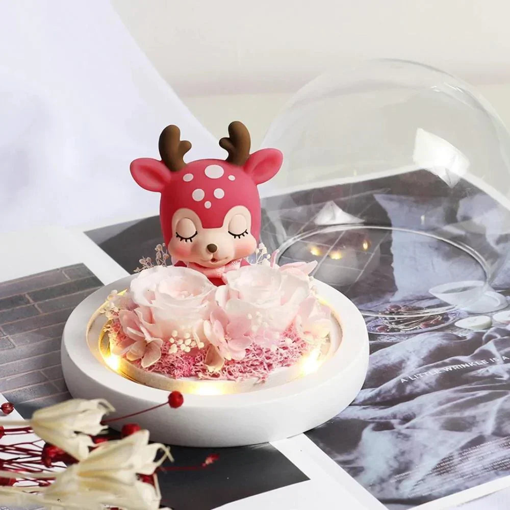 Pink rose and red deer figurine LED display, encased in glass dome.  Warm LED lights, perfect gift.