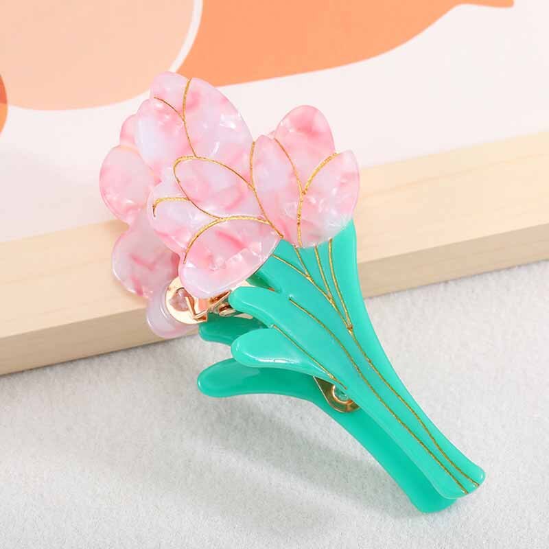 Pink tulip acrylic hair claw clip with teal stem, gold accents, approx. 10cm x 4.8cm. Perfect for parties or everyday wear.