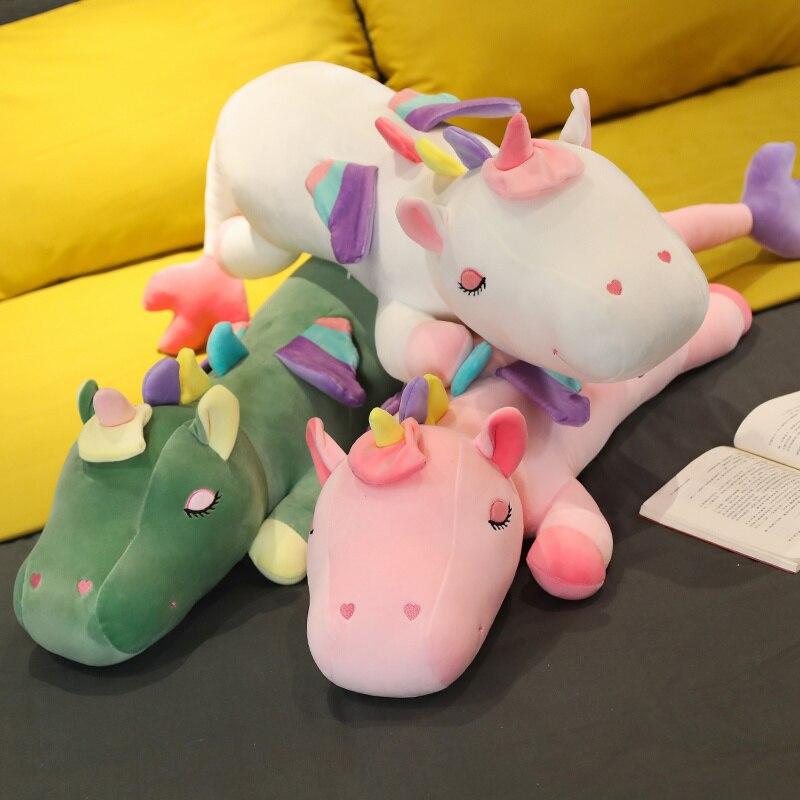 Soft plush unicorn body pillows in pink, white, and green; premium PP cotton filling, for cozy sleep.