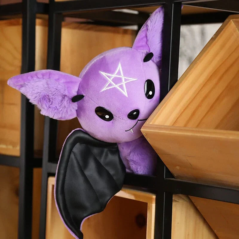 Purple kawaii bat plush toy with black faux leather wings and pentagram detail. Soft PP cotton filling. Halloween gift.