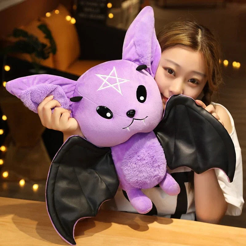 Adorable purple kawaii bat plush toy with black faux leather wings and pentagram detail.  Soft PP cotton filling.