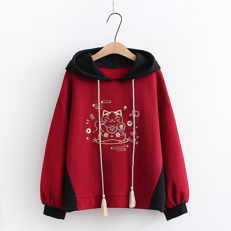 Red Harajuku lucky cat hoodie and mini skirt set; soft cotton blend, embroidered details, drawstring hoodie, contrasting panels.