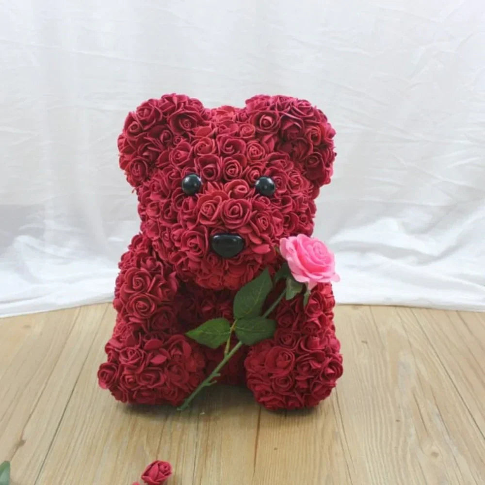 Red rose teddy bear gift, plush handcrafted keepsake with artificial roses, perfect for Valentine's Day or birthdays.