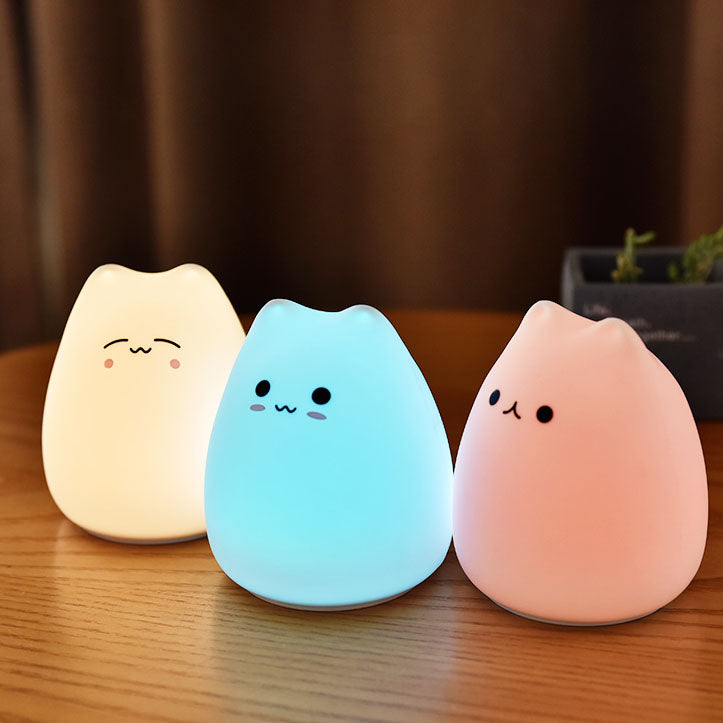 Adorable silicone cat night light, color-changing LED, 3 cute designs, soft & portable, perfect for bedrooms.
