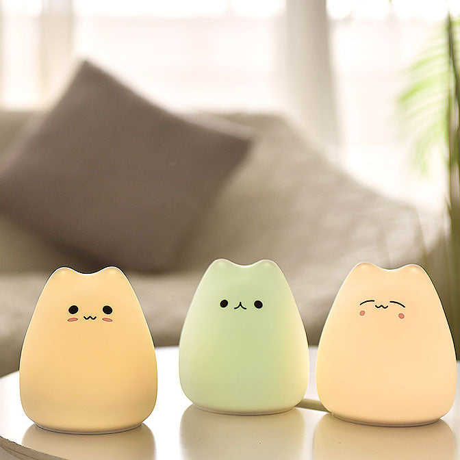 Adorable silicone cat night light; color-changing LED, 3 cute designs, soft & calming. Perfect for bedrooms.