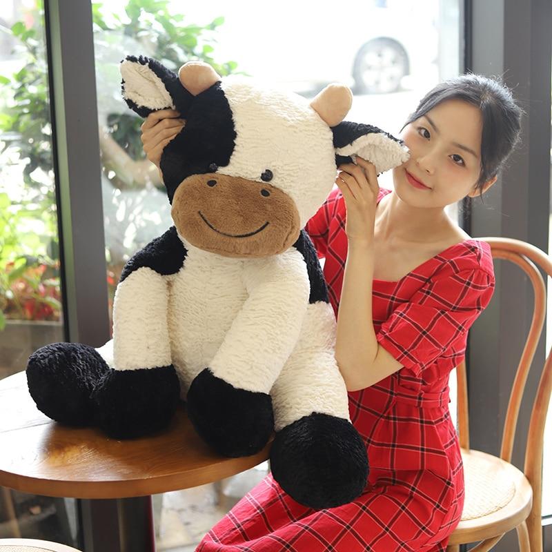 Adorable large white and black spotty cow plush toy, made with soft PP cotton, perfect for cuddling.