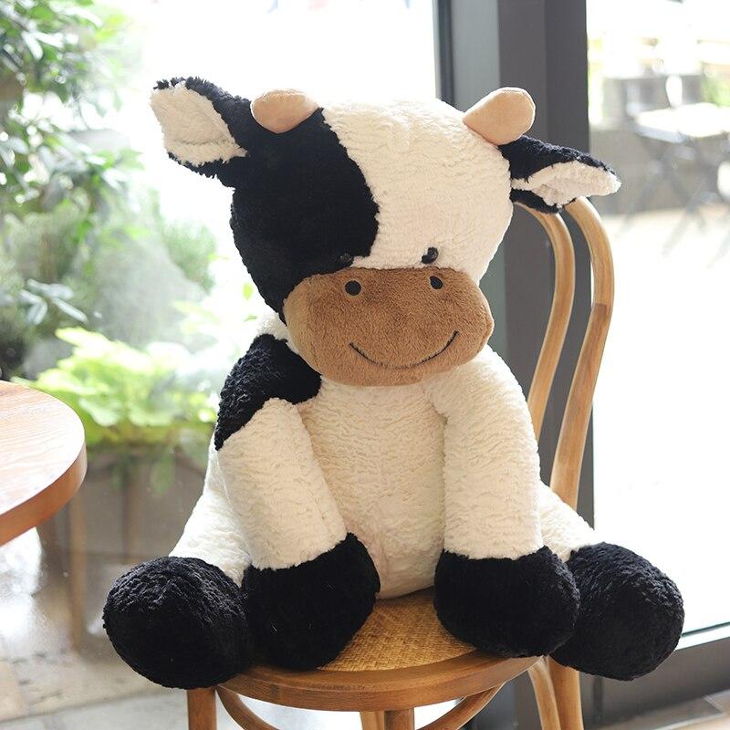 Soft white and black spotty cow plush toy, made with premium PP cotton. Hypoallergenic and perfect for cuddling.