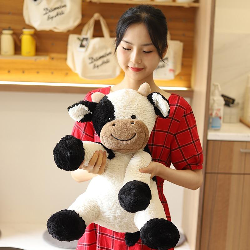 Adorable spotty cow plush toy, soft PP cotton filling, hypoallergenic, white with black spots, perfect gift.