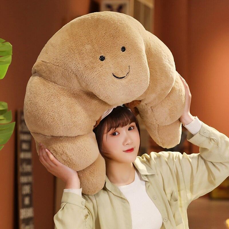 Tan curly croissant plush toy; super soft, huggable, PP cotton filled; small, medium, large sizes.