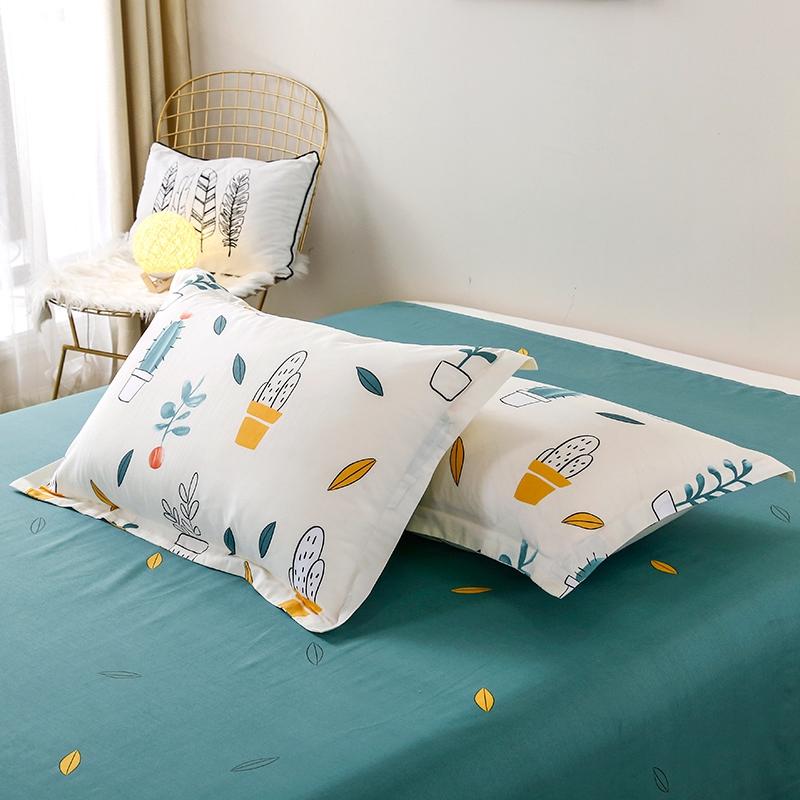 Reversible cactus floral bedding set in teal and white microfiber. Features soft, comfortable polyester, and includes duvet cover, flat sheet, and pillowcases.