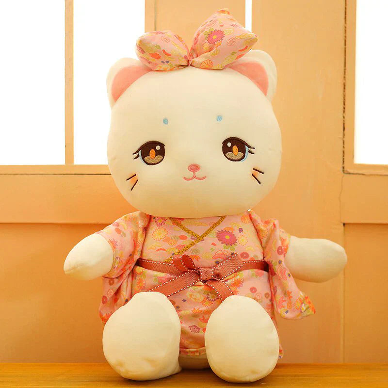 Adorable white plush cat wearing a pink floral kimono, perfect for cuddling. Soft PP cotton filling.