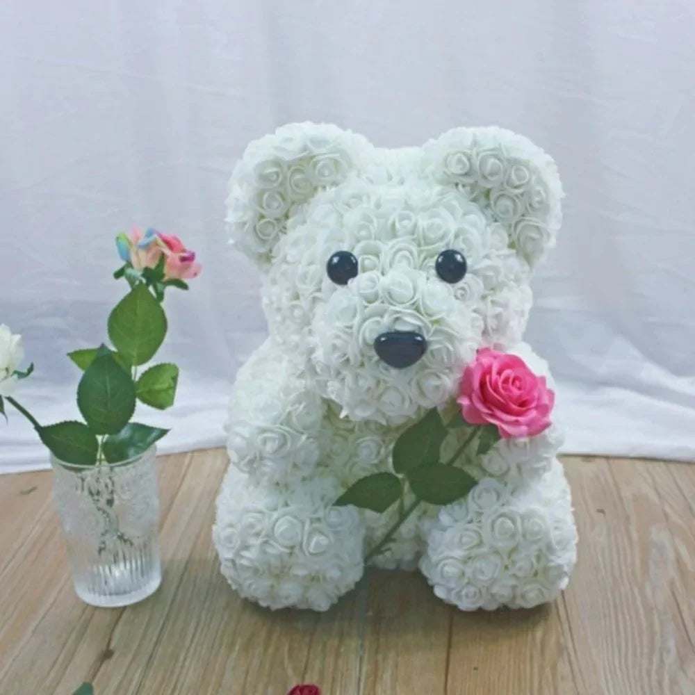 White rose teddy bear gift, handcrafted plush bear adorned with artificial roses, perfect for Valentine's Day or any special occasion.