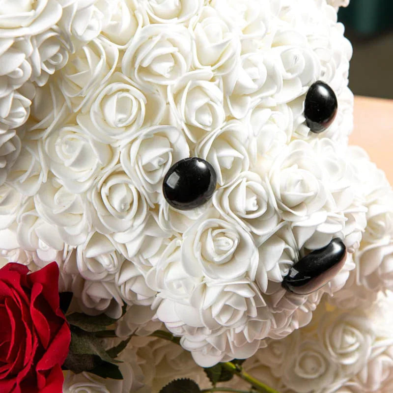 White rose teddy bear gift, plush handcrafted bear adorned with artificial roses.  Perfect for any occasion.