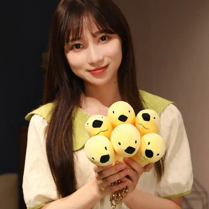 Adorable yellow banana-shaped seal plush toys, made of soft PP cotton, perfect for cuddling. Hypoallergenic and ethically sourced.